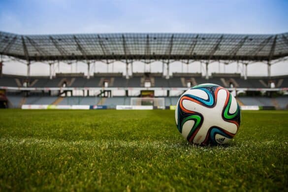 soccer ball on a field in a stadium